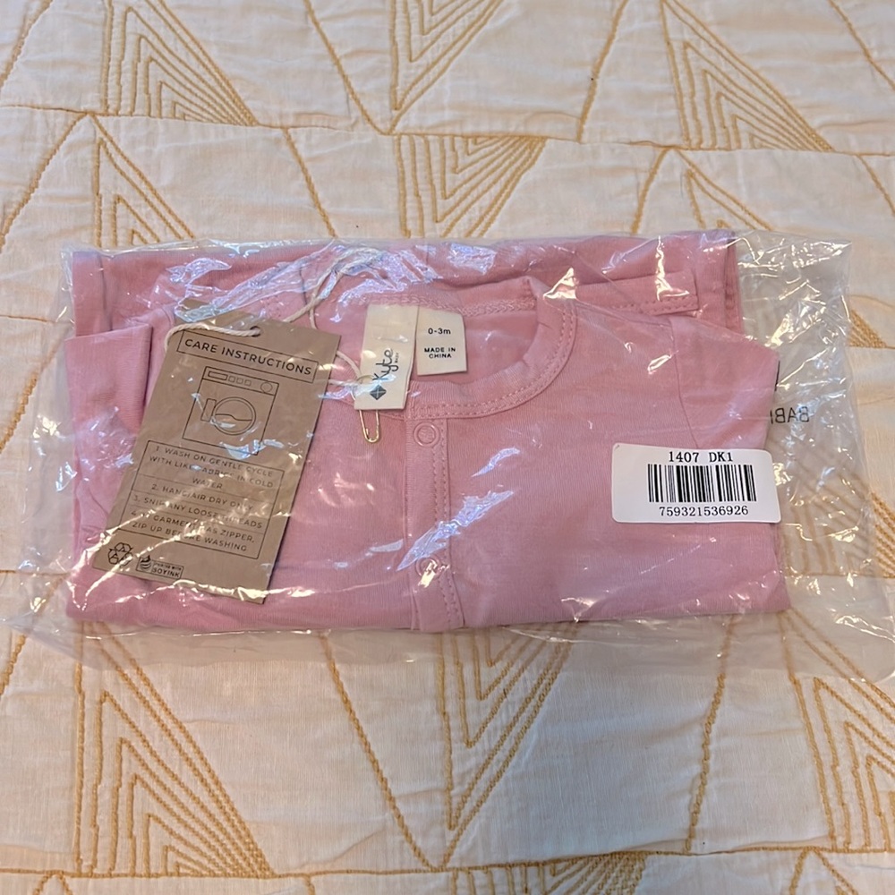 Kyte baby pink romper with snaps